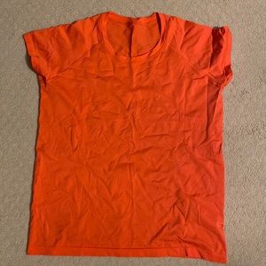 Anti-stink Lululemon top is made for training and running! Bright Orange color.